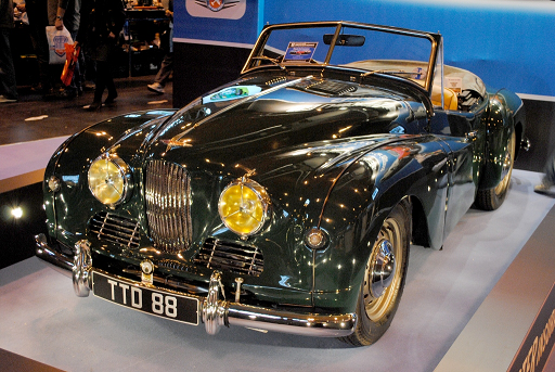 1954 Jowett Jupiter SC -- 1486 cc overhead-valve flat four convertible, 900 produced 1950–1954. Tubular semi-space frame, hydraulic brakes. Class-winner at 1950 24 Hours of Le Mans in its first race. Also, outright win of the 1951 Lisbon International Rally and class win at Le Mans in 1951.